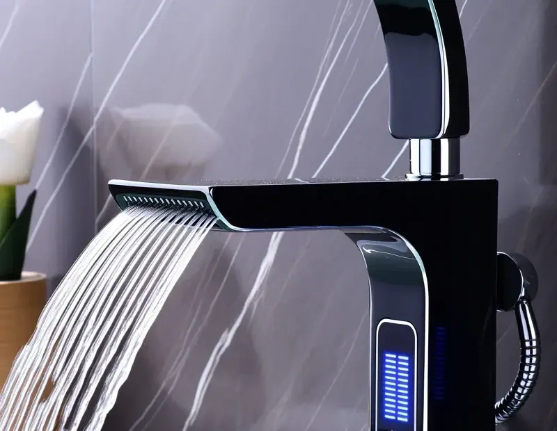 Black bathroom faucet with LED blue glow and digital temp display - perfect for winter bathroom updates
